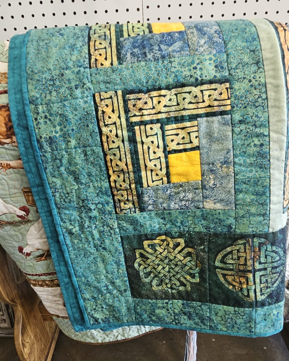 Portrait of a local quilter who consigns textiles at Mountain Homemade